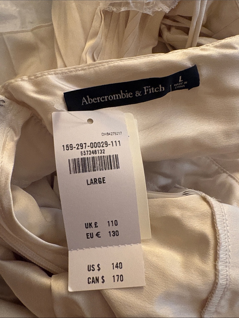 Abercrombie & Fitch Pleated V-Neck Wide-Leg Jumpsuit in Cream - Picture 3 of 3